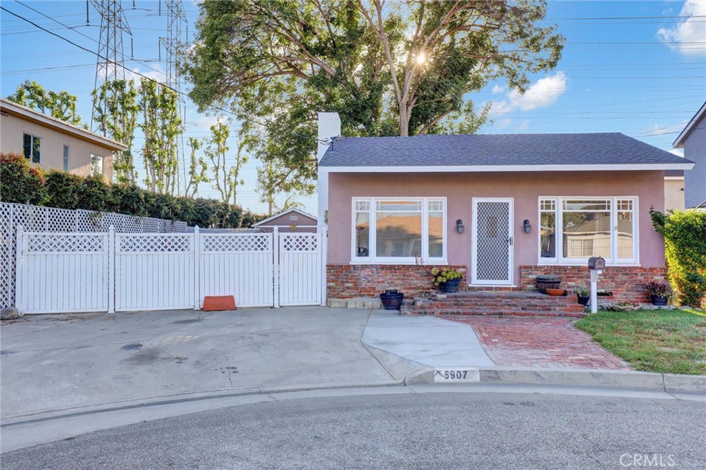 Charming 1931 single-story home with character, potential, and thoughtful updates, situated on an oversized 5,035 sq. ft. lot. This 2-bedroom, 1-bath home features original hardwood floors throughout, tile flooring in the kitchen and bath, and a cozy living room with an actual fireplace as its centerpiece. The primary bedroom includes French doors leading to the backyard and a faux stone fireplace for added charm. A divider wall was added in the primary for privacy but can easily be removed to expand the space.
The kitchen offers pride-of-ownership enhancements with updated cabinetry, stainless steel appliances, and generous storage. Other improvements include a leveled foundation and a roof replaced within the past year. A dedicated laundry room adds convenience.
Outdoors, enjoy a large backyard with a deck perfect for entertaining, mature trees for shade, and multiple sheds, one large and two smaller, for storage or projects. A workbench with vice is included. The property also provides a 3-car driveway and RV parking, making it both versatile and functional.
Located in a desirable Lakewood neighborhood, this home is close to schools, shopping, dining, and nearby parks, offering both comfort and convenience. With its mix of vintage charm and recent upgrades, it’s a wonderful opportunity to make your own.