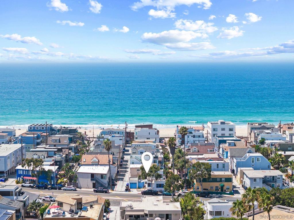First time on the market in 30 years! Enjoy the beautiful coastal lifestyle, approx. 300 feet to the sand, in this 2-story, 2-bedroom, 2-bathroom home with a yard in Mission Beach. It's nestled between the Pacific Ocean and Mission Bay, where you can enjoy beach paths such as the Ocean Front Walk and Bayside Walk. The property offers convenient access to waterfronts, beach paths, year-round recreation dining and entertainment. The 2-story layout provides flexibility. The first floor includes a 1-bedroom residence with a living room, kitchen, and 1-full bathroom. Upstairs, a private 1-bedroom, 1-full bathroom with its own entrance which creates options for guests, extended family, or office use. A wraparound deck extends the living space outdoors, perfect for relaxing with coffee, dining, or gatherings. With a 1-car garage, driveway, and public street parking. NO HOA. The seller has architectural design plans, adding to the living space by expanding the house’s footprint to encompass THREE full suite bedrooms, each with en-suite bathrooms adjoining. This prime location puts you in the heart of San Diego’s coastal charm and iconic attractions, steps away from shops and restaurants. Enjoy Belmont Park’s historic Giant Dipper, SeaWorld, and Mission Bay’s paddle-boarding, biking, and beach volleyball. The boardwalk and shoreline for year-round outdoor fun. Experience the ultimate coastal lifestyle with nearby neighborhoods like La Jolla, Pacific Beach, Old Town, Balboa Park, and the Gaslamp Quarter, all a short drive away. The airport is a 6.5 mile drive, welcome home!