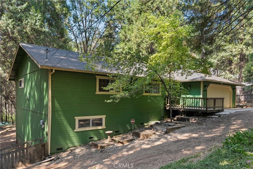 If you love nature and wildlife, then look no further. This rarity sits on over (1) acre and is located in the beautiful City of Magalia. This home boast over 1,400 SQFT of open living space. The exterior features a newly installed roof (2020), a 2-car garage, fully fenced yard for privacy, a propane tank, and a storage shed for your wood or tools. It gets better, be amazed with this beautiful, spacious back wood deck, and front wood deck. The interior features a spacious and beautiful open concept kitchen/dining living room, and a wood burning stove to keep you warm in the winter. Furthermore, the master bedroom features an extra-large walk-in closet, a sliding glass door that leads to the gorgeous back deck, linen closet, and dual sinks in the master bathroom. Additionally, there are (2) additional spacious bedrooms with spacious closets, along with a second full bathroom. In addition, this home is conveniently located near shopping centers, restaurants, parks, and is located near Skyway for easy travel to Paradise, Chico, or Oroville. Call or text today and make this your next home.