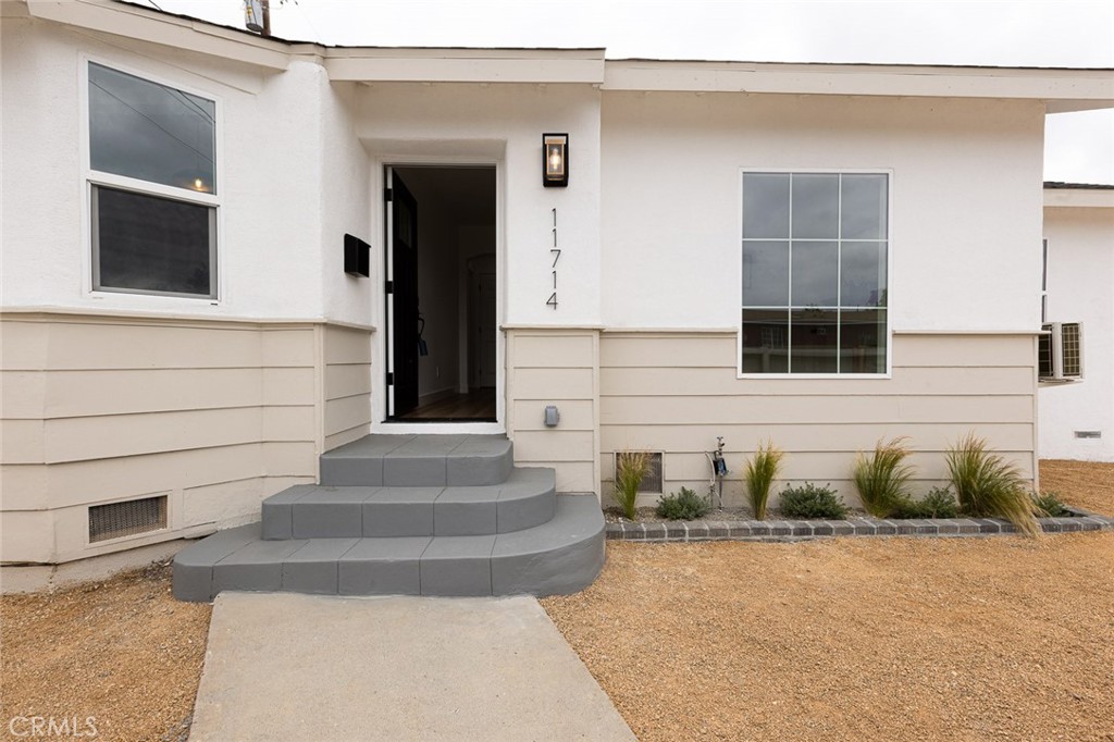 Bright and tastefully renovated, this move-in ready 2-bedroom, 1-bathroom single-family home offers approximately 774 square feet of refreshed living space with a stylish desert-inspired touch. This inviting single-story residence showcases thoughtful upgrades, including fresh interior and exterior paint, new flooring throughout, modern light fixtures, a fully updated bathroom, and a contemporary kitchen with sleek quartz countertops. The spacious kitchen and living area provide the perfect blend of comfort and functionality for everyday living or entertaining. Outside, the low-maintenance, desert-style landscaping offers year-round beauty and water efficiency, creating an ideal setting for those who value both style and convenience. Centrally located with easy access to the 105 Freeway, parks, schools, shopping, and all that Los Angeles has to offer, this home is perfect for commuters and city-lovers alike. Priced to sell and ready for immediate occupancy—this desert-inspired gem won’t last long!
