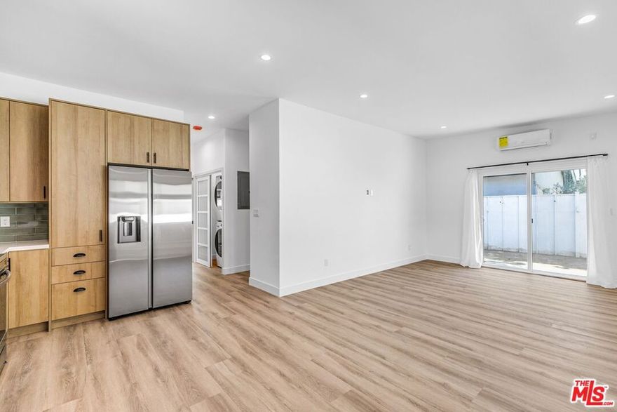 Be the first to live in this all-new, fully private single-family backhouse in the heart of Eagle Rock. Offering approximately 900 sq. ft. of modern living, this 2-bedroom, 2-bathroom home combines comfort, convenience, and style. Inside, you'll find an open-concept layout with wood floors, recessed lighting, and ductless AC units for year-round comfort. The brand-new kitchen features a stainless steel refrigerator, electric stove, dishwasher, and plenty of storage. A stacked washer/dryer is included, and two hallway closets provide even more space to keep things organized. Both bedrooms are filled with natural light, and two modern bathrooms offer sleek finishes. Blinds are installed throughout, making move-in easy. Step outside to your fully fenced outdoor space with beautiful teak fencing. Tenants are welcome to add a grill or outdoor seating to make the space their own. One driveway parking space is included. Located in desirable Eagle Rock, you'll enjoy neighborhood coffee shops, restaurants, and easy access to Pasadena and Highland Park