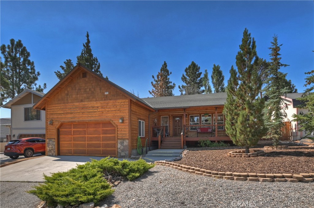 Valley View Gem – Custom Built, Immaculately Maintained! Located in the highly desirable Valley View neighborhood, this custom, quality-built home (2004) has been lovingly maintained and is in pristine condition. The light and bright interior features an open living room with a cozy fireplace, creating the perfect gathering space for family and friends. Warm knotty pine tongue-and-groove ceilings and accents, pine cabinetry, and custom flooring add a touch of mountain charm throughout. This home offers 3 spacious bedrooms, including a primary suite with private bath, plus an additional full bathroom. Step outside to a large back deck overlooking your spacious, private backyard—an ideal setting to relax, entertain, and breathe in the crisp mountain air. Easy access to HWY 38 and just 12–15 minutes to the hub of Big Bear, where you’ll find ski slopes, the lake, and charming shops.