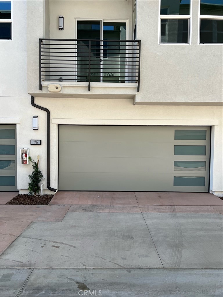 GATED community at 100 West in Anaheim. Well-styled contemporary luxe. Come home to a welcoming foyer and downstairs bed/bath flowing up the inviting stairs to the spacious great room, casual dining area, and desirable covered balcony. The well-designed gourmet kitchen is highlighted by a center island with breakfast bar, plenty of counter and cabinet space, and sizable pantry. This home has upgrades, in Kitchen Quartz Countertops & vertical backsplash, in primary bathroom upgraded shower walls. The serene primary bedroom suite is enhanced by an ample walk-in closet and spa-like primary bath with luxe shower and private walk-in closet. Secondary bedrooms feature roomy closets and shared bath. Additional highlights include custom window coverings throughout a convenient second level powder room and centrally located third level laundry and spacious roof top deck with a spectacular view of Disneyland’s Fireworks display. 100 West is centrally located in the heart of Orange County minutes to major entertainment & shopping centers such as Disneyland, Honda Center, Angel Stadium Walk. Easy & convenient access to excellent medical centers, college campuses, major freeways & transportation hubs. Solar panels installed to help reduce electric bills. Parking is limited to two (2) cars in attached garage.