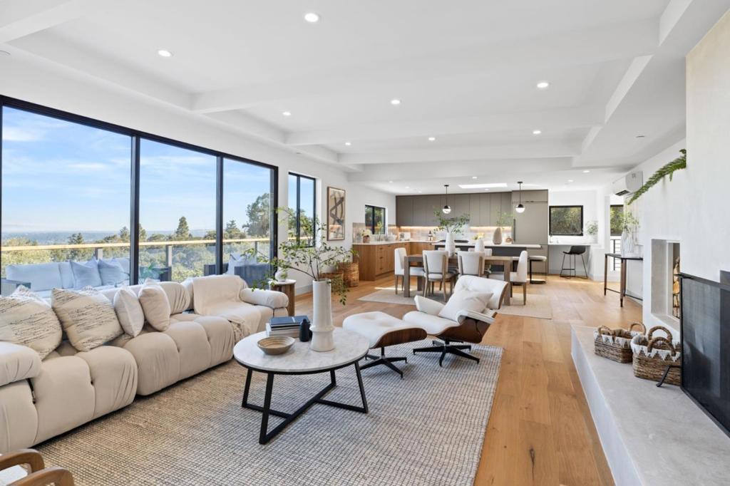 Stunning, fully remodeled modern home nestled on .8 acres in the heart of Palomar Park, offering majestic views from every space. This masterpiece boasts 4 spacious bedrooms & 3.5 luxurious baths, with primary suites on each floor. Each well-appointed bedroom opens onto a walk-out deck, where you can soak in the panoramic vistas of the surrounding beauty. The open-concept kitchen is a chef's dream, featuring a large island and top-of-the-line appliances including wine fridge, gas range & microwave drawer. An oversized sliding glass door on the upper level seamlessly connects the open-concept living space to the expansive deck, which runs the length of the home- perfect for entertaining & taking in the stunning surroundings. Custom touches, like the charming homework nook in the kitchen, a built-in planter above the fireplace & a Park City ski lift swing repurposed as seating on the deck, are sure to delight. Additional features include a dedicated laundry area, A/C, 2-car garage, owned solar & a private, peaceful setting adjacent to Eaton Park, with access to scenic trails. This Palomar Park treasure offers a harmonious blend of luxury, comfort & nature, perfect for those seeking both privacy & proximity to outdoor adventures, with a strong sense of community.