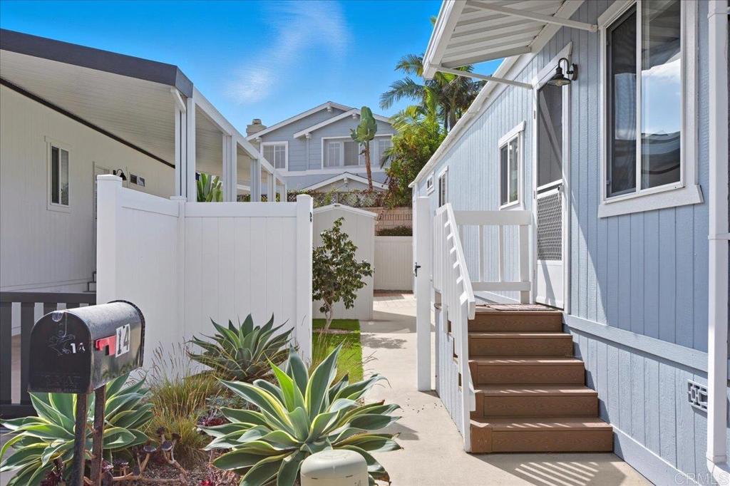 Coastal Living Just Steps from the Sand! Welcome to your beachside retreat at 6550 Ponto Drive, Space 14 in the highly sought-after Lanikai Lane community—an All-Ages park located directly across from South Carlsbad State Beach. This newly remodeled 2-bedroom, 2-bath home offers the perfect blend of style, comfort, and location. Step inside to a bright and airy open floor plan filled with natural light. The home features a beautifully updated kitchen and spacious living areas. Enjoy peace of mind knowing everything has been thoughtfully refreshed, allowing you to move right in and start living the coastal lifestyle. Relax on your private patio while enjoying the ocean breeze or take a short stroll to the sand for sunsets and surf. Living at Lanikai Lane means more than just a home—it’s a lifestyle. The vibrant community offers resort-style amenities, including a pool, jacuzzi, clubhouse with billiards and table tennis, a family room with fireplace, and gathering spaces perfect for entertaining. Beautifully landscaped grounds, welcoming neighbors, and unbeatable beach access create an atmosphere where every day feels like vacation. This move-in ready home is your chance to embrace the coastal lifestyle you’ve been dreaming of at a fraction of the cost of nearby real estate. Don’t wait—this rare opportunity for affordable beach living won’t last long!