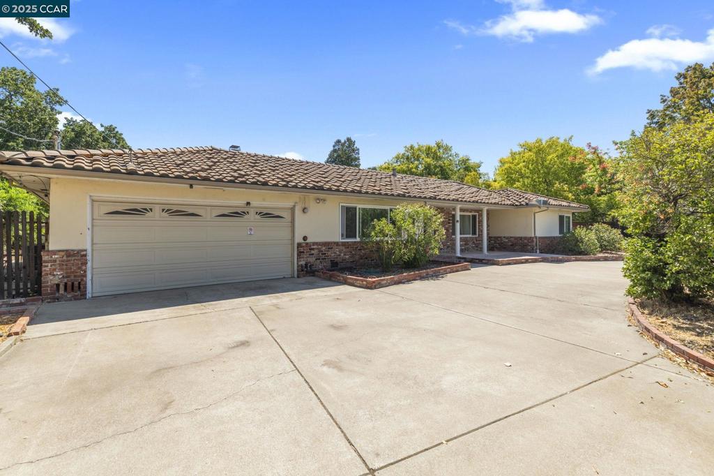 Discover the allure of this expansive single-story 4bd/2bth rancher with attached 1bd/1bth ADU situated steps away from the vibrant heart of downtown Broadway Plaza. Nestled on nearly three-quarters of an acre (0.73), this property presents an exceptional opportunity for significant expansion including an “additional” ADU or a potential subdividing lot subject to Walnut Creek's approval. The lot itself is a near-perfect rectangle, offering an ideal canvas for your vision. Be sure to review the drone photos for stunning overhead views. This residence is an entertainer and chef's dream, featuring a spacious cherrywood kitchen complete with elegant tile backsplash and a full suite of stainless steel appliances, including a double oven, chimney style hood. The home is bathed in natural light, thanks to the floor-to-ceiling wall to wall windows along the rear in the expansive bonus room. Primary bedroom on one end of the house, and three other bedrooms on the opposite side of home. The indoor laundry room is very spacious. Outside, there is a sparkling pool with water fountain, Baja Shelf and hot tub, spacious decks, two gazebos, grape vine field. AUD offers fully equipped kitchen, W/D, a full bath and split A/C and heater system. Located within the top rated Walnut Creek Schools.