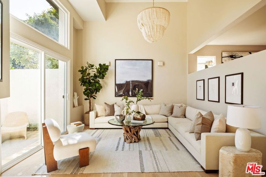 Refined coastal living, elevated by design. Just a half block from Palisades Park, this completely remodeled townhouse rests quietly north of Montana yet radiates the effortless sophistication that defines Santa Monica's most sought-after neighborhood. Thoughtfully redesigned for those who appreciate quality, craftsmanship, and style, the home exudes natural warmth through curated finishes and meticulous attention to detail. A double-height, light-filled living room opens seamlessly to a private landscaped patio, an inviting setting for morning coffee or relaxed entertaining. Throughout, solid White Oak wood flooring and Farrow & Ball designer paint unify the multi-level layout, creating a sense of calm continuity. The spacious dining area offers both formal and counter-height options and connects to a beautifully functional chef's kitchen featuring SubZero refrigeration, a six-burner Wolf range, Cove dishwasher, porcelain farmhouse sink, quartz counters, and artisan tile work- a perfect balance of performance and understated elegance. Two bedrooms, each with an en-suite bath, are thoughtfully placed on separate levels for privacy. A generous landing in between provides the ideal space for a library, reading nook, or home office. The top-floor primary suite is a sanctuary of its own, complete with a customizable walk-in closet and a spa-like bath featuring dual sinks, custom tile work, soaking tub, separate shower, and a skylight that floods the space with natural light. Direct access from the private two-car garage outfitted with new epoxy flooring and LG front-loading washer and dryer adds everyday convenience and flexibility, offering room for storage, a gym, or creative workspace. Set within a boutique 14-residence community with a pool, spa, and manicured grounds, this townhome offers rare tranquility just moments from the ocean, bluffs, and the boutiques and cafes of Montana Avenue. Turnkey, timeless, and impossible to replicate. This is California coastal living at its most refined.