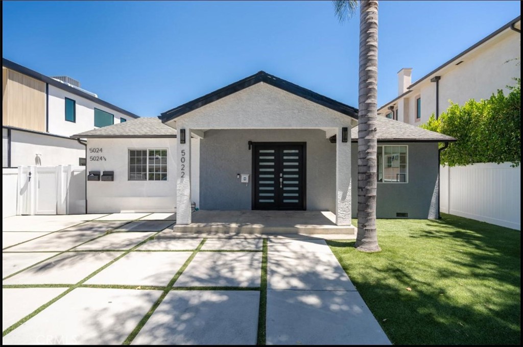 Exceptional South of the Blvd Encino Compound featuring three fully permitted and legally recognized units, each with its own address: 5022, 5024, and 5024½ Lindley Ave. Situated on a gated, landscaped lot in one of the Valley's most sought-after neighborhoods, this rare offering presents a unique opportunity for multi-generational living, investment income, or an ideal owner-user setup. The main residence (5022) boasts approximately 4 bedrooms and 2 bathrooms, a spacious open-concept layout, and direct access to a beautifully private backyard retreat complete with a sparkling pool, sun-soaked patio, and mature landscaping perfect for relaxing or entertaining. The property also includes two detached ADUs, each featuring 2 bedrooms and 2 bathrooms, with full kitchens, and private entrances. These units offer excellent income potential or flexible living for extended family, guests, or even a home office setup. With approximately 3,000 square feet of total living space, this gated compound offers privacy, versatility, and tremendous value in a premier Encino location just south of Ventura Blvd. Enjoy easy access to top-rated schools, upscale shopping, dining, and major freeways. Whether you're looking to live in one unit and rent the others, house multiple generations under one roof, or expand your investment portfolio with a triplex-style property, this one-of-a-kind compound checks every box. Don't miss this rare opportunity to own a turnkey, income-generating property in the heart of Encino.