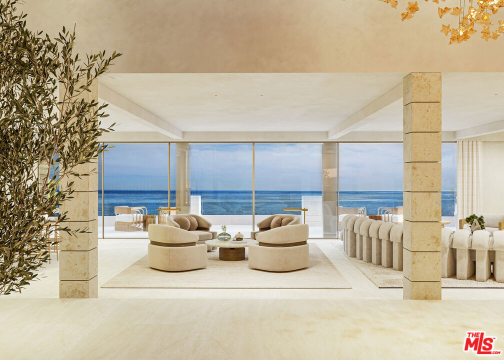 Burnout from the Palisades fire set on 0.29 acres on desirable Carbon Beach. Named Carbon Oasis, the five-bedroom, five-and-a-half-bathroom home spanning 4,900 square feet of interiors is undergoing a meticulous multimillion-dollar remodel. Named Carbon Oasis, the five-bedroom, five-and-a-half-bathroom home spanning 4,850 square feet of interiors is undergoing a meticulous multimillion-dollar remodel. Reminiscent of an Aman-inspired spa retreat with a modern twist, the residence is designed as a waterfront oasis influenced by the worldly travels of its developer. A lush green wall facade welcomes guests upon entry, curating a glimpse into the Zen wonderland tucked behind closed doors. Unobstructed panoramic views of the Pacific Ocean are on display in nearly every room, with custom champagne-toned glass sliders by industry leader Styline blending indoors and outdoors. Every inch of the elegant living and entertainment spaces is thoughtfully crafted and covered from floor to ceiling with organic materials, including limestone flooring and walls clad in Onyx, split face travertine, and roman clay plaster finish, while the bedrooms are dawned in parquet walnut wood. A central interior pond designed by the world-renowned Danny Wang features a lush garden with a statement tree and a linear outdoor fireplace by Montigo designed to inspire peace and tranquility. Half a million dollars' worth of Eggersmann cabinetry is customized in the kitchen, closets, and laundry room. The gourmet chef's kitchen boasts Miele appliances plus a bar draped in exotic materials. The second-floor principal suite showcases those coveted Pacific Ocean views and offers dual closets, the owner's bathroom adorned in onyx and split face travertine plus a sunlight infrared sauna. Additional luxurious amenities and features within the state-of-the-art smart home include a Josh.ai speaker-controlled system, fitness room, custom glass wine vault, planned cantilever hot tub, and a guest cottage with two bedrooms and two bathrooms. Outdoors, find 60 feet of beachfront and views stretching from Palos Verdes to the Malibu Pier, along with an outdoor summer kitchen covered in Ipe wood, sub-zero, and wolf appliances. Billionaire's Beach is Malibu's most prestigious address and home to only about 70 lots with current and past high-profile owners. Ideally located, the residence is a short distance to Malibu hot spots, including Nobu and Soho House.
