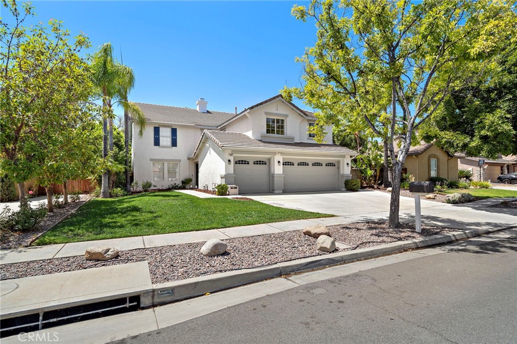 (Professional photos by Tuesday) Stunning 6-bedroom, 3-bath home with NO HOA, LOW TAXES, and fully paid 8.4 kW SOLAR! Located in a highly desirable neighborhood in the foothills of South Corona, this spacious home offers an ideal floorplan with a downstairs bedroom and full bath—perfect for guests or multi-generational living. Enter through double doors into a light filled home featuring formal living and dining rooms, a generous sized family room that opens with gas fireplace, which opens into an updated kitchen with brand-new quartz countertops, large island, stainless steel appliances, and breakfast nook with slider to the backyard. Upstairs you'll find five more spacious bedrooms, including a luxurious primary suite with double-door entry, dual walk-in closets, soaking tub, separate shower, dual vanities, and a sit-down vanity area. A large loft offers flexible space for a home office, playroom, or second living area. The private backyard is pool-sized and perfect for entertaining family and friends alike for a barbecue, play dates, or evening drinks with a large patio, mature fruit trees (lemon & pomegranate), raised garden beds, and terraced planting areas. Energy-efficient upgrades include solar (installed 2018), tankless water heater, newer dual zoned HVAC (Dec 2022), whole-house fan, NEST thermostat with sensors, smart home window shades, and smart irrigation for both grass and drought-tolerant landscaping. The 3-car garage offers ample storage, with plenty of driveway and street parking. Walk to Santiago High School and local parks, with easy access to the 91/15 freeways, express lanes, shopping, dining, and trails. This one truly has it all—space, upgrades, and location!