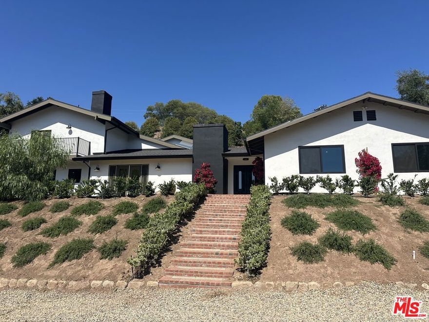 Welcome to 1131 Rancho Drive, an exceptional opportunity to own a beautifully renovated ranch-style home on just over an acre in one of Ojai's best neighborhoods. Boasting 3,934 square feet of elegant living space, this expansive property features 6 bedrooms and 5 bathrooms, thoughtfully designed to offer both comfort and versatility. The heart of the home is a chef's dream: a gorgeous kitchen adorned with designer tile, a large center island, and a walk-in pantry, perfect for entertaining or everyday living. Elegant and rustic hardwood floors run throughout, creating a seamless blend of modern refinement and classic ranch charm. Enjoy the flexibility of an attached JADU (Junior Accessory Dwelling Unit), ideal for guests, multigenerational living, or rental income. Step outside to a sparkling pool and beautifully landscaped grounds, offering space to relax, gather, and enjoy the serenity of Ojai. One of the property's standout features is the hillside lookout deck.  Your private perch with stunning views across the valley, perfect for morning coffee or evening sunsets. This is a rare chance to own a turnkey home with scale, style, and soul in one of Ojai's most desirable enclaves.