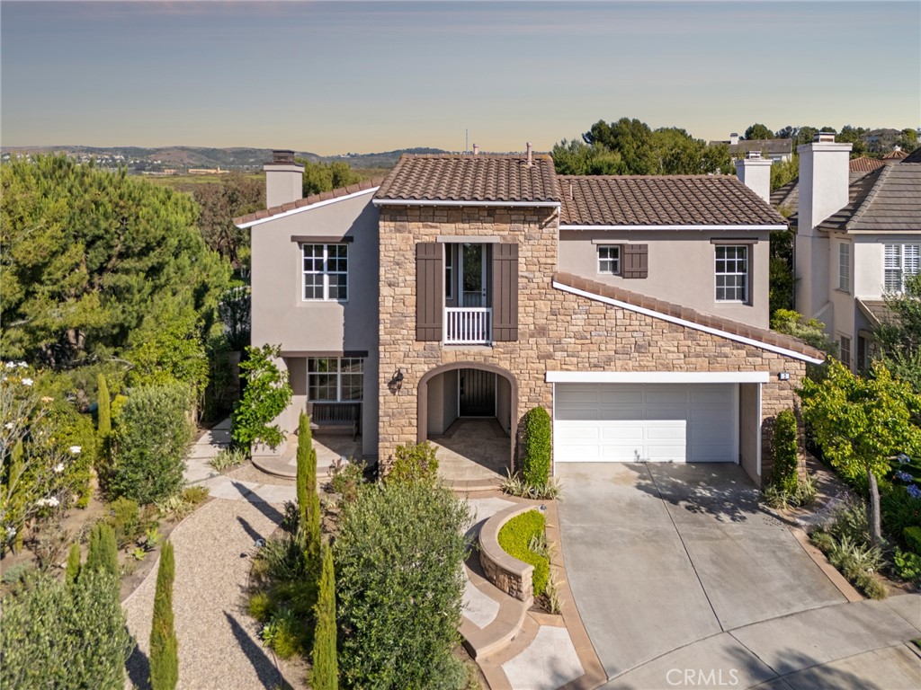 Luxury Estate in Prestigious Newport Ridge North – Private Cul-de-Sac Haven
Tucked away at the end of a serene cul-de-sac with no neighbors to the side or behind, this elegant 5-bedroom, 3.5-bath residence offers nearly 3,500 square feet of refined living space in the coveted guard-gated community of Newport Ridge North.
The home is framed by lush, Italian-inspired landscaping curated by Rogers Gardens, with expansive front and back yards offering unmatched privacy, tranquil fountains, inviting seating areas, and a built-in BBQ perfect for entertaining.
Step through the entry into a sunlit interior courtyard, the heart of the home, surrounded by a formal living room, dining room, and a versatile main-level bedroom or office. The chef’s kitchen features granite countertops, a generous center island, and premium stainless steel appliances, seamlessly flowing into a spacious great room with casual dining, a cozy fireplace, and TV Viewing.
Upstairs, discover four additional bedrooms, including a luxurious primary suite with a fireplace, oversized walk-in closet, and spa-style bath featuring dual vanities, a Roman shower, and a freestanding soaking tub.
The oversized two-car garage provides ample storage, while the community amenities elevate your lifestyle with a junior Olympic pool, spa, clubhouse, BBQ areas, tennis and basketball courts, and a playground designed for kids and pets alike.
A rare blend of privacy, comfort, and resort-style living in the hills of Newport Coast.