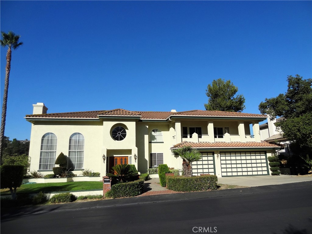 This custom built Mediterranean mansion sits on over an acre of premium California land, located in Walnut, CA – Walnut is like the Beverly Hills of the San Gabriel Valley, rated # 1 City by Money Magazine many times. The house boasts a panoramic breathtaking view of city lights and mountains and has extreme privacy with practically no neighbors and is located in the private Sunset Ridge – Weaver Ranch gated community. The house is a dream come true, with pillar design and extensive interior and exterior upgrades. High cathedral ceilings, huge windows and custom made circular windows make it known as the Round window mansion in the neighborhood. The curb appeal is jaw dropping and it is a rare house that has its own indoor spa, steam room and sauna, not to mention a huge master suite with its own spa, retreat and fire place. The house was designed by a famous architect Frank something …. The whole house has intercom / piped music built in which is very helpful for both central music and talking to others in the house. Four suites, three fireplaces, two wet bars and several balconies make this house a must own property. Very Slick with Granite counters all over and a fresh coat of paint both inside and outside the house. Central vacuum system. 4 giant Palm trees on the property. Room to add guest house / pool and tennis courts. Perhaps down the years you can also build one or two houses on the lot if the county/ HOA allows that.