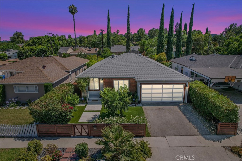 Welcome to this stunning home in the heart of Encino! Where contemporary design meets everyday functionality. This beautifully crafted residence offers a perfect blend of style, comfort, and convenience — ideal for buyers seeking a turnkey property with high-end finishes and generous outdoor space. Step into an open floor plan flooded with natural light, featuring gorgeous hardwood floors, high ceilings, and recessed lighting throughout. The modern kitchen is a chef’s dream, equipped with stainless steel appliances, sleek cabinetry, and direct access to the large backyard — an entertainer’s paradise perfect for weekend barbecues, outdoor dining, or simply relaxing in your own private oasis. The bathroom's boast custom tile flooring in the bathrooms, with elegant shower-in-tub combinations for a spa-like experience. Convenient in-kitchen laundry adds ease to your daily routine, while the well-sized bedrooms provide comfort and space to unwind. Every detail of this home has been thoughtfully designed, making it the perfect blend of functionality and luxury. Located just minutes from Ventura Blvd, you’ll enjoy easy access to shopping, dining, parks, and major freeways — all while living in a peaceful residential pocket of Encino. Whether you’re a first-time buyer, a growing family, or simply looking for a modern space with plenty of room to entertain, this is a rare opportunity you don’t want to miss. Schedule your private tour today and experience the best of Encino living!