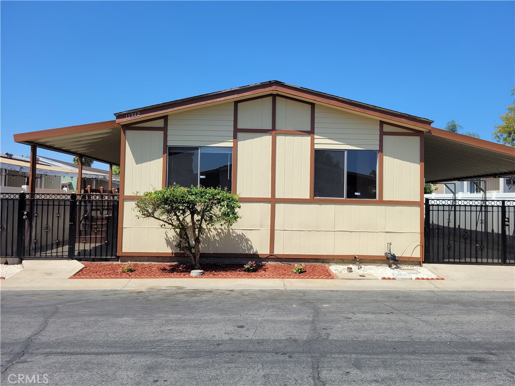 Cozy manufactured home in the Peachwood community. Property is in San Bernardino County near the border of Pomona with Montclair Schools. Featuring 2bedrooms, 2 full baths, inside laundry, and an additional shed for storage or work space. Open kitchen with stainless steel appliances. Spacious dining and living area. Laminate flooring throughout living area and bedrooms. Master suite with a walk-in closet. Central Air. Covered front porch and attached carport parking for 2 cars. Property is fully enclosed with vinyl fence and security gates.