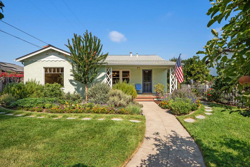 Welcome to 711 4th Street, a single-level 3-bedroom, 2.5-bathroom home offering approximately 1,936 square feet of timeless charm in one of Gilroy's most coveted neighborhoods - often referred to as the Willow Glen of Gilroy. Set on a 6,250 square foot lot, this residence beautifully blends historical character with thoughtful updates, creating a warm and inviting place to call home. From the curb, the home radiates charm with its picturesque landscaping and fantastic curb appeal. Inside, hardwood floors flow through much of the home, complementing the rich architectural details that speak to its history. The spacious floor plan includes generously sized bedrooms, with one bedroom at the rear featuring exterior access - an ideal setup for a guest suite or home office. The detached 2-car garage with alley access adds convenience, while the private, garden-like backyard provides a peaceful retreat for relaxing or entertaining. A newer composition roof ensures lasting peace of mind. Adding to the appeal, all assigned public schools are just a short stroll away, making school drop-offs a breeze. Downtown Gilroy's vibrant restaurants, cafes, and bars are also within walking distance, allowing you to enjoy the best of local dining and nightlife right from your doorstep.