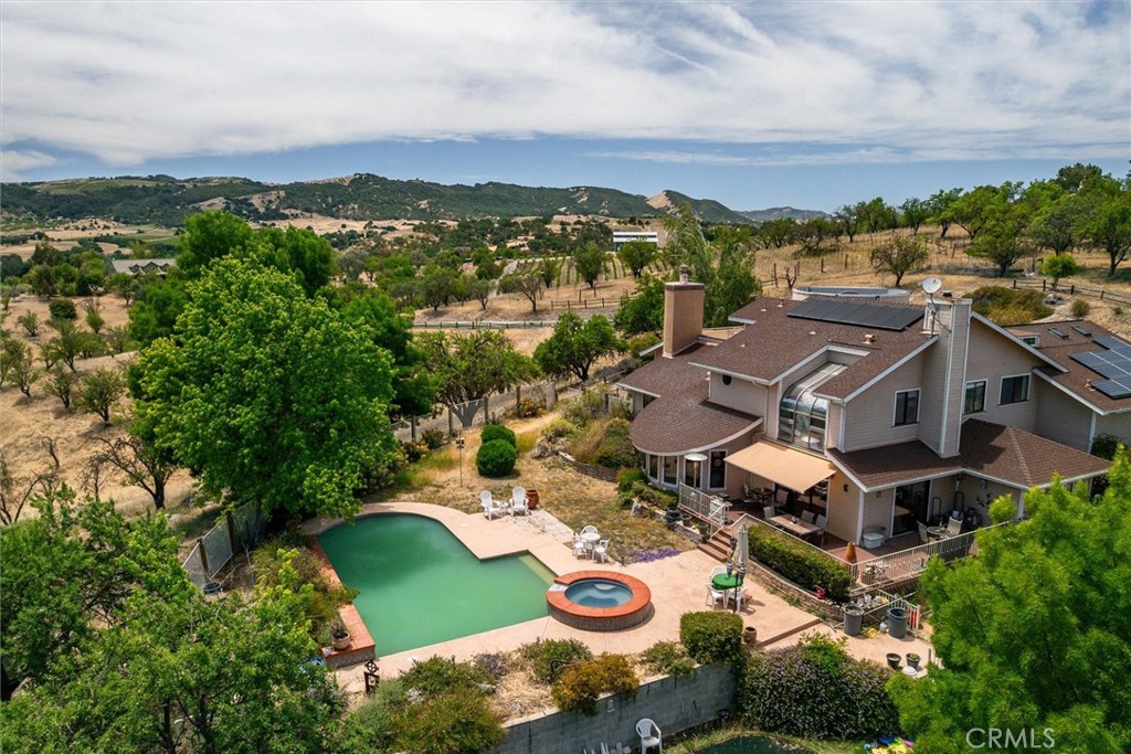Westside Wine Country Retreat – Nearly 13 Acres of Potential and Beauty.
Welcome to your dream estate in the heart of wine country! Nestled on nearly 13 acres of gently rolling hills and surrounded by world-renowned vineyards and wineries, this Westside gem offers the perfect blend of serenity, space, and opportunity. With breathtaking views of the surrounding vineyards and countryside from almost every window, this property is a true escape. Step inside the grand entrance and you’ll find a formal living room and dining room with a cozy fireplace. Downstairs you'll find an open-concept living space that flows seamlessly from the kitchen, dining area, and main living room — all overlooking the pool and relaxing hot tub, perfect for enjoying California sunsets with a glass of local wine.
This spacious home features 2 bedrooms and 2 bathrooms downstairs, ideal for family or guests while enjoying the privacy of your upstairs primary suite to take in the stunning views along with a third guest bedroom or ideal for an office or nursery.
There's also a secret, bonus loft room above the 3-car garage — perfect as a game room or art studio. There's plenty of room to park your motorhome, boat, or other toys with a large driveway and turn around area. With just a bit of TLC, the right buyer can transform this into a spectacular Westside estate — a rare opportunity to own a slice of paradise in one of the Central Coast’s most desirable locations. Just a short drive to Lake Nacimiento, less than 45 minutes to the beautiful beaches of the Central Coast, and minutes from world-class wineries, this is more than a home — it’s a lifestyle.
Come see the potential. Come fall in love. This is wine country living at its finest.