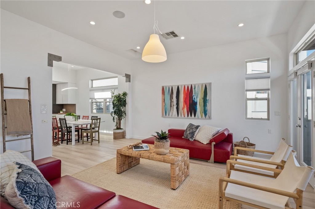 Rarely does a property like this come to market. Two units over 3000 SF and a massive car "barn"! The upstairs has 10.5' ceilings, a rooftop deck, ocean views, that's bright, spacious, fresh and captures the essence of modern coastal living. Multi-generational living possibilities? Living in one rent the other? Rent both and keep the garage for garage toys? Possibility to build 1-2 ADU's? Family compound? Opportunities abound!
Enjoy ocean views from the upstairs living room and primary bedroom and balcony that spans the front. The kitchen offers all full extension drawers, custom pantry storage, cabinetry above and below, additional cabinets facing the living area, and under cabinet lighting and a new dishwasher. Cooktop is electric however there is a gas hookup in place. This unit also has central HVAC and a tankless water heater. There’s also a rooftop deck that offers sweeping views of sailboats and Catalina Island on clear days, the Korean Bell and coastal port town of San Pedro.
The downstairs unit, also around 1500 sq/ft, features 3 bedrooms, 2 baths, a spacious living area, dining and second living area that leads to a private patio. Additional highlights include granite countertops, recessed lighting, ceiling fans, new dishwasher and double pane windows throughout. This unit includes washer/dryer hookups, private patios, tandem gated parking, & a carport.
The oversized garage is a rare asset with three commercial roll up doors, multiple skylights, a permitted three quarter bath, heavy duty commercial shelving, a spiral staircase leading to a loft. It even a dedicated water heater, its own electric subpanel, two 220V outlets and a 120+ sq/ft enclosed storage room with a separate exterior entry. The garage has ceilings approximately two stories high and a steel gantry beam with an open truss system that eliminates the need for interior support columns, maximizing usable space. It can fit five cars and potentially up to 12+ or more depending on size of cars/configuration and if adding lifts. Alongside the garage is a large exterior space that can accommodate an RV or even a boat. Whether you're a car collector, enthusiast, creative, or home based business owner, this setup is exceptional. Gross Income Est $12,000/mo.
The property is not under RSO and may allow for up to two ADUs. Buyer to verify with the city. Properties with this level of flexibility, scale, and opportunity are truly rare, all while enjoying what’s already in place.