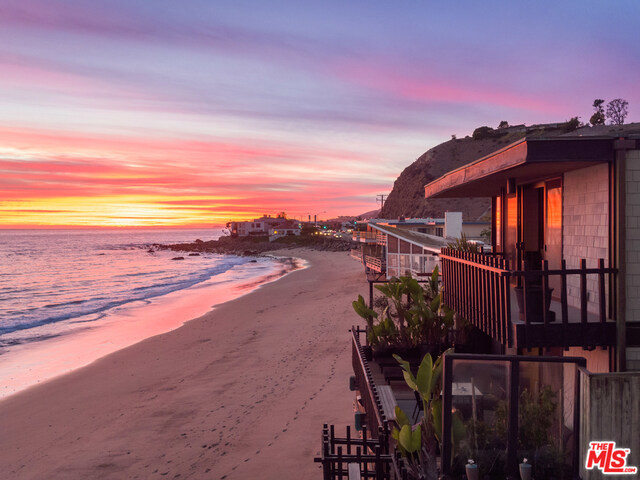 ***Listing Agent 4: David Berg*** Designed by the ever-iconic Buff & Hensman duo in 1968, The Brown House is an architectural tour-de-force situated on an exclusive 40 feet of La Costa Beach in Malibu. The preserved, original design showcases cedar shingles & dark stained wood, lending an organic yet modern aesthetic that harmonizes with its natural surroundings. Upon entry, the two-story foyer flows into the great room & dining area, all framed by floor-to-ceiling glass windows that unveil LA's most unobstructed & sought-after ocean views. A dramatic spiral staircase leads to three bedrooms & two baths on the second level, including the luxe master suite with a balcony & spectacular sightlines of the sea.