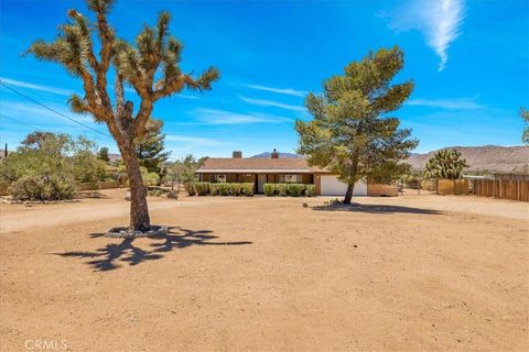 Photo of 7394 Warren Vista Avenue, Yucca Valley, CA 92284 (MLS # JT26149736)