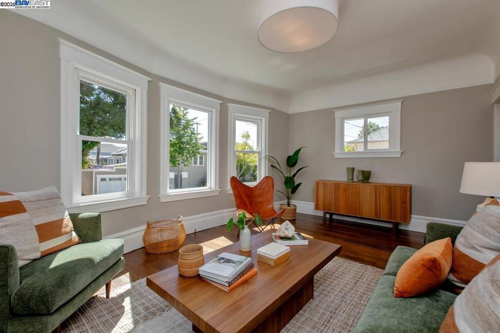 Recently updated inside and outside, this vintage 1908 Colonial Revival-style cottage is filled with charm and lovely early 20th-century architectural features. Located just 2 blocks to Encinal Market and only 4 blocks to both Lincoln Middle and Otis Elementary schools, this sweet, newly updated home features 2 bedrooms, 1.5 bathrooms, formal living and dining rooms, a large eat-in kitchen and a bonus room/office. The home's semi-finished Victorian-era "high basement" w/ garage measures an additional 893 SF, potentially providing significant home square footage expansion (buyer to verify with county/city codes). Recent updates/remodels include new interior/exterior paint, refinished hardwood floors, new bonus room carpeting and new light fixtures. The large eat-in kitchen has new flooring, quartz counters, new hardware and refreshed cabinets. A bonus room off the kitchen makes a great home office, studio or playroom, and gives easy access to attic storage. The newly landscaped front and side yards create wonderful curb appeal + great gardening opportunities! The home's sought-after East End location is just minutes to parks, schools, the shoreline, the South Shore Center and the SF Ferry. Loads of charm in this East Bay jewel!