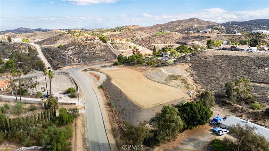 LAKE MATTHEWS AWESOME AREA AND AWESOME LOT READY FOR UILDING 1.5 TO 2 ACRES THAT HAS BEEN COMPLETELY GRADED AND READY FOR THE HOME WE ALREADY HAVE APPROVED PLANS FOR. Note plans will have to be upgraded. This lot has 2.75 acres almost 2 acres of it is graded and ready to build on and then there is another more than .75 acres that is ready for your private farm. Avocados, Citrus trees, berries, chickens, goats and anything else. GUESS WHAT THE LOT ALSO HAS A WELL DRILLED AND READY FOR THE PUMP AND OFF THE GRID.