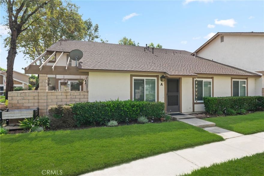 Location! Location! Welcome to 5466 E Willow Woods Ln #A, a charming two bedroom, one bathroom condo offering 882 square feet of comfortable living in one of Anaheim’s most desirable, tree-lined communities. This single level home is highly sought after for its private setting with no unit above, a bright and open layout, and a spacious enclosed patio that extends the living area outdoors. The interior feels welcoming and well lit, featuring upgraded double pane windows, recessed can lighting, an updated electrical panel, a complete updated HVAC system with a Nest smart thermostat updated just 7 years ago, and a newer smart range that’s less than a year old, making it move-in ready for the next owner.



This home also offers a detached one car garage with the potential to add a door for direct access from the house, one assigned parking space, and plenty of additional street parking for guests. With its grassy area right out front, quiet surroundings, and family-friendly atmosphere, the home combines convenience with comfort.



The Willow Woods community is quiet, friendly, and family-oriented, complete with a sparkling pool perfect for relaxing or enjoying time with family and neighbors. Ideally located near Anaheim Hills and Yorba Linda, you’ll find easy access to parks, hiking and biking trails, golf courses, shopping, dining, and entertainment just minutes away. Major attractions like Disneyland, Knott’s Berry Farm, and Orange County’s beautiful beaches are just a short drive away. With its warm and welcoming design, desirable location, family oriented and welcoming community, this condo is the perfect place to call home.