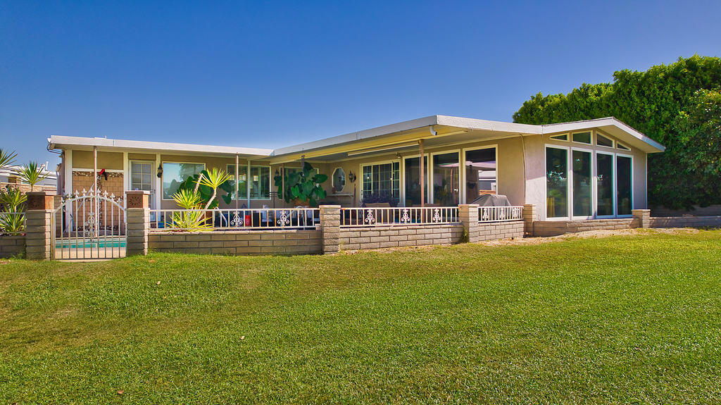 Upon entering the property, you will be captivated by the panoramic views of the mountains and golf course that are visible from the open concept gathering areas, highlighted by the distinctive fireplace. Adjacent to the kitchen, the sunlit living area serves as the centerpiece of the home's interior design. This space seamlessly integrates indoor and outdoor living, creating an ambiance that is both welcoming and dynamic. Floor-to-ceiling windows invite natural light to flood the room, establishing an airy and bright atmosphere. The open-concept layout ensures smooth transitions, making this living area perfect for both casual relaxation and lively gatherings.The living area provides direct access to the patio and pool, enhancing the home's al fresco entertainment vibe! Whether hosting a summer party or indulging in a quiet morning coffee amidst the fresh air, the connection between indoor spaces and the garden creates a harmonious living environment.The expansive lot offers ample space for entertainment. The primary bedroom suite shares the same spectacular views and presents an opportunity to update the room into a tranquil and relaxing space tailored to your specific preferences. It also has direct access to the pool and spa. What a great idea!With HOA fees only $400 monthly plus includes Free Golf, Cable TV & Internet, 24 hour Security, Clubhouse with Restaurant, Bar and meeting rooms. You can be as active as you desire with Golf, Pickle Ball, Bocce Ball, Shuffleboard in its own Air-Conditioned Building, 3 pools and 3 spas plus Fitness Center, Billiard Room, Rec Center as well as our own Library, News Bulletin and Cable TV station Channel 98. This vibrant community offers more than just amenities--it delivers a lifestyle infused with charm and camaraderie. Residents enjoy the opportunity to participate in regular social events, creating a close-knit environment for neighbors to deepen connections. Don't miss the opportunity to make this your dream home by calling to schedule a private showing today!