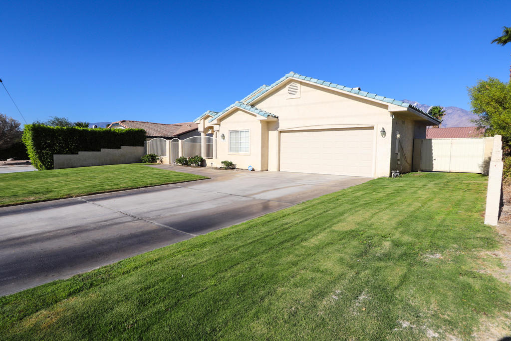 Spacious 3 bedroom, 2 bath home located in the desirable Rio Vista neighborhood in Cathedral City. This well-maintained property offers an open concept layout with vaulted ceilings, tiled flooring, and plenty of natural light throughout. The kitchen features granite counters, while the primary suite includes a walk-in shower and the guest bathroom offers a shower and soaking tub. Enjoy the private gated courtyard, a pool-sized backyard with natural grass, lemon tree, covered patio, and block wall fencing for added privacy. Additional highlights include a 2-car garage, separate interior laundry room, and colonial window shades. Conveniently situated just outside the Verano community, you'll love being close to shopping, Starbucks, dining, Stater Bros., and quick I-10 access--just minutes from downtown Palm Springs. This home has tons of potential and is ready for its next owner!