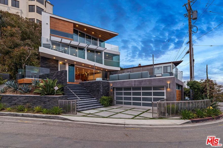 By the award-winning PAA Studio, this architectural offers explosive panoramic ocean & coastline views from nearly every room. Upon entry, guests are greeted by an open great room and modern chef's kitchen featuring Miele & Sub-Zero appliances, stone counters, and a large center island. Floor- to-ceiling glass doors give way to an enormous deck/lounge overlooking the glorious Santa Monica Bay. Organic elements such as wood ceilings, White Oak hardwood floors & a unique geometric staircase promote warmth within a contemporary design. Up the floating stairs or elevator, the unrivaled indoor-outdoor master suite occupies the entire top level; featuring pocket glass doors that run the length of the entire private balcony, an incredible walk-in closet & a spa-like bath with a huge soaking tub & oversized shower. The lower level features a media & billiards room. This architectural tour de force defines sophisticated California living with unparalleled commanding views.