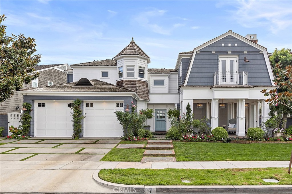 Located within the coveted guard-gated enclave of The Castaways, this exceptional Cape Cod-inspired residence blends timeless style with modern coastal luxury. Set on one of the most desirable lots in this exclusive 118-home community, the property enjoys rare privacy by backing directly to Bob Henry Park, creating an open, tranquil backdrop. This impeccable family home embraces the best of laid-back beach living with refined elegance. With approximately 3,889 square feet of thoughtfully designed interiors, the home features 5 spacious bedrooms and 6 bathrooms, offering a layout that encourages connection and comfort. The open-concept main level flows effortlessly from formal to casual spaces, highlighted by a sun-drenched family room, a cozy fireplace-warmed living room with French doors, and a formal dining area ideal for entertaining. The heart of the home is the chef’s kitchen, outfitted with premium appliances, a large central island, and an extended countertop that serves as a second prep or serving area. A casual dining nook framed by a wall of glass offers views of the resort-style backyard, making indoor-outdoor living seamless. Step outside to enjoy year-round sunshine in a private oasis that includes a sparkling pool and spa, a shaded dining cabana, and a professionally designed putting green. The lush, expansive yard becomes an effortless extension of the home’s living space. Additional main-level highlights include a guest suite, guest powder room and a laundry room. Upstairs, the primary suite is a true sanctuary, with custom built-ins, a spacious walk-in closet, a private balcony, and a spa-inspired bathroom complete with dual vanities, a soaking tub, and an oversized walk-in shower. In addition, three guest bedrooms each feature ensuite baths, custom millwork, and designer window treatments. A versatile bonus room with a separate entrance offers endless possibilities as a media lounge, game room, or fourth guest room retreat. Completing the home is a three-car attached garage and convenient access to scenic hiking and biking trails, Newport Bay water activities, and postcard-worthy ocean views just blocks away. All this is just minutes from world-class shopping and dining, Balboa Island, vibrant 17th Street-Costa Mesa (known for food, fitness, and fun), and John Wayne Airport.