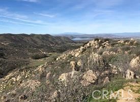 Lot is just over the hill from Temecula's Wine Country. Can access vacant lot from the bottom of State St which turns into Deportola, go left at Saddleback Road, then right on Pixley Canyon Road and go about a mile past Benji Road. Theres about 3 acres of rolling hills. Open vacant lot would be good for growers. Very private location in between Riverside County Land Conservatory.
