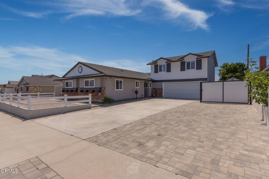 Stylishly Updated Home with Flexible Living Space! Welcome to your Camarillo dream home! This beautifully upgraded 4-bedroom, 3-bath home offers 1,950 sq ft of thoughtfully designed living space on a 6,534 sq ft lot. The freshly painted main level includes 3 bedrooms - 1 with an en-suite bath, while the versatile upstairs 4th bedroom/bonus room - complete with walk-in closet, kitchenette, and en-suite bath could be ideal as a primary retreat, second living space, media room or whatever best fits your lifestyle.The tastefully remodeled kitchen features modern finishes and top tier appliances including a double oven, gas stove top, microwave, dishwasher, farmhouse sink, and refrigerator. Additional highlights include hard-surface flooring throughout, smooth ceilings, recessed lighting, ceiling fans, and central A/C for year-round comfort. A cozy fireplace in the living room adds warmth and charm. Sliding patio doors from both the living and dining rooms open to the entertainer's backyard, creating a seamless indoor-outdoor living experience.The backyard is perfect for outdoor gatherings and relaxation with a built-in BBQ, covered patio, above-ground spa, low-maintenance turf, attractive pavers, water features, a large storage shed and block walls accented by vinyl fencing. The expansive concrete and paver driveway - both extra-long and wide, easily accommodates multiple vehicles and possible RV parking. Owned solar keeps utility costs low, and there's NO HOA to limit your lifestyle.Conveniently located near parks, schools, shopping and restaurants, this move-in ready home offers the perfect blend of style, comfort, and functionality.