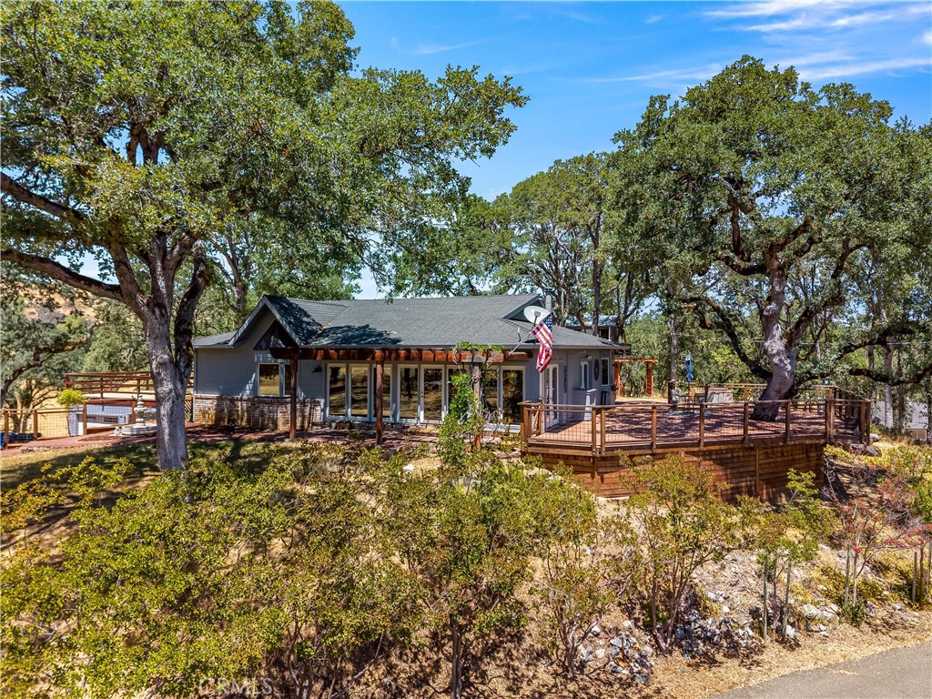 Welcome to the dream property—where timeless charm, thoughtful design, and modern comfort come together on 10 serene acres. This custom built, second owner home screams character and indescribable magic, that you have to see to believe. Privately situated at the end of a paved road behind a gated entry, this custom-built home offers the ultimate in peace, privacy, and functionality. Inside, you’ll find warm wood floors, an inviting open-concept layout, and abundant natural light throughout. The heart of the home is the beautifully designed kitchen featuring a center island, gas range, stainless steel appliances, and seamless flow into the living and dining areas—perfect for entertaining and everyday living. Off of the kitchen is the oversized laundry/butlers pantry, perfect for storage and a great place to drop dirty clothes after a long day. The cozy sunroom with floor-to-ceiling windows invites the outdoors in, creating a perfect spot for relaxation. The quaint primary suite offers a peaceful retreat with its own private bath, and access to the back patio. Secondary guest bedroom includes built-ins and a generous walk-in closet. Use the greenhouse for year-round gardening potential, as well as let the outside garden area flourish. A fully equipped secondary dwelling unit (ADU) provides a living room, kitchen, bedroom, and full bath—ideal for multigenerational living, a home business, or rental income. Attached to the ADU is a storage room, as well as additional oversized guest space. Bring your animals as the property is crossed fenced and ready for livestock. Whether you’re seeking a private sanctuary, a multi-use homestead, or an entertainer’s paradise, this one-of-a-kind property delivers character, comfort, and flexibility in a breathtaking setting.