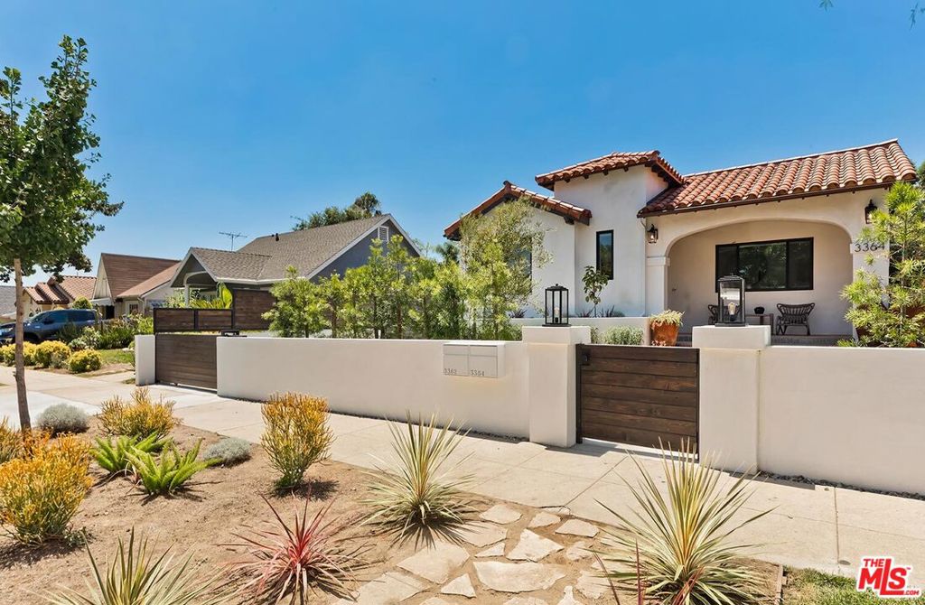 Just steps from Atwater Village's vibrant Glendale Boulevard is 3364 Garden Avenue, an exquisitely reimagined contemporary Spanish home designed with modern aesthetics and style. Upon entry, you are greeted with an open plan sanctuary where dining, living and kitchen flow naturally through the home. The main living room has volume ceilings with an original wood burning fireplace and picturesque windows that brings in the natural sunlight throughout the day. This forever home is designed for both everyday living and entertaining. The kitchen with center island has custom white oak cabinets and Thermador appliances. Through the arched hallway, there are 3 all en suite bedrooms, a powder room and a laundry room. The spacious primary bedroom has a spa like bath and spacious walk-in closet with French doors that lead to the sunny rear courtyard designed for indoor/outdoor California living at its best. Across the courtyard under the cedar pergola, is a one bedroom ADU with volume ceilings, cozy living room and kitchen with breakfast bar. Joining the ADU, is a Recreation room that can be suited for a home office, gym, or studio. This gem in the heart of Atwater Village has over 2800 square feet of total living space and is crafted with the finest elevated materials and finishes. Hedged and gated, this lushly landscaped home features olive trees, mature Japanese Maples and offers the ultimate feeling of home.