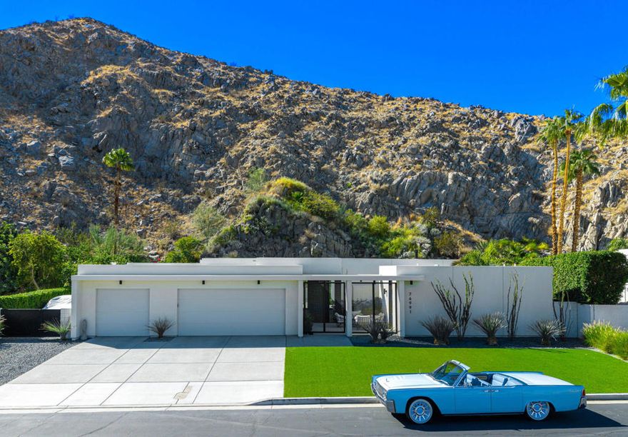 Stunning Mid-Century Modern Home in Historic Indian Wells Country Club. Built in 2021, this 4BD/3BA residence is a masterful blend of new construction and classic mid-century modern design, showcasing high-end finishes and thoughtful craftsmanship throughout. Perfectly positioned within the Indian Wells Country Club, this home offers classic style and effortless indoor-outdoor living. From the moment you enter, you're welcomed by a breathtaking mountain backdrop and a sophisticated open floor plan that features; high ceilings, custom plank porcelain flooring, smooth coat interior walls, dimmable recessed lighting and expansive sliding glass doors in every room that fill the space with natural light. Richly appointed bedrooms are complemented by spa-inspired bathrooms, including two serene outdoor showers. The gourmet kitchen is a focal point of the home, featuring sleek quartz countertops and stainless-steel appliances, all overlooking a spacious great room with a striking fireplace and three floor-to-ceiling glass sliding doors that provide a flawless transition to your private desert retreat. Outside, take in a picturesque desert setting complete with a hybrid saltwater lap/swim pool with multicolored lighting, a gas fire pit, low-maintenance natural landscaping, and extensive outdoor lighting--perfectly designed for both daytime lounging and evening entertaining. Additionally, A fully detached, self-contained casita adds versatility, equipped with a full kitchen and washer/dryer--ideal for guests or extended stays. Bonus: No HOA dues, owned solar system, 3-zone controlled HVAC, Artificial turf, oversized 3-car garage w/ golf cart parking and just a 5-minute walk to the Indian Wells CC clubhouse. This is desert living reimagined--modern luxury, classic charm, and a prime location.