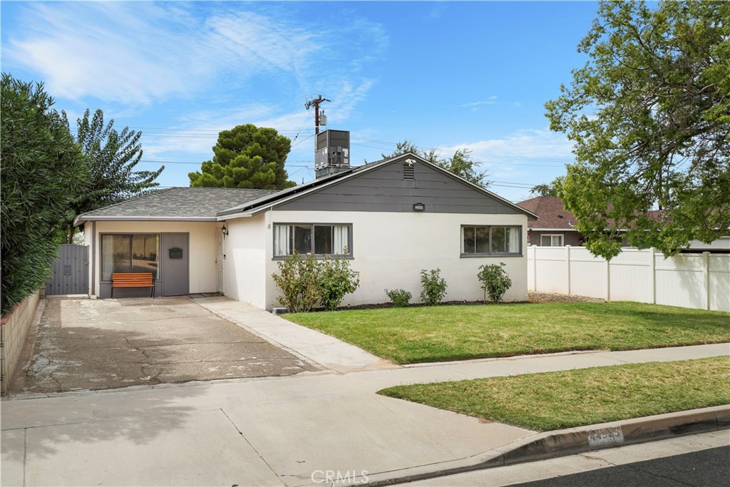 Welcome to this beautifully upgraded 3-bedroom, 1-bath home, featuring 1,184 sq ft of living space. Situated on a 5,921 sq ft lot with lush green lawns, this property offers a fantastic outdoor lifestyle with a covered patio perfect for entertaining.
Inside, you'll find a remodeled bathroom with a new shower, toilet, and stylish vinyl plank flooring. The kitchen has been enhanced with upgraded appliances, and a stackable washer and dryer are included.
Recent improvements include a new HVAC system, water heater, copper plumbing, and roof, ensuring peace of mind. The home also comes with an existing solar system, to be assumed by the buyer. This move-in-ready home combines modern comfort with timeless charm.