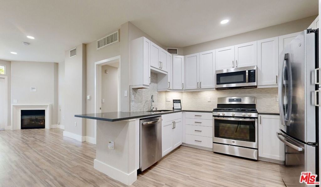The ultimate luxury apartment in prime Beverly Grove! This 1-bedroom, 1 bathroom Sorento Premier apartment features upgraded finishes and fixtures, brand new modern kitchen, a fireplace, and a private balcony. Upon entry you'll find light pouring in through the windows, and an open floor plan. Gourmet kitchen equipped with quartz countertops, stainless steel appliances including a French-door refrigerator, 5-burner gas stove & oven. Laundry in unit, A/C, top of the line, no expense was spared! Gated community with secured parking including EV, 24/7 security patrol, bio-metric access, smart homes (alerts you if the door opens!), secured elevator access, salt water pool, state of the art gym, concierge, clubhouse, & spa! Located across from the Grove, and in 8/10 school district! Other units available - please inquire.Lease prices vary based on lease length. Available Now!