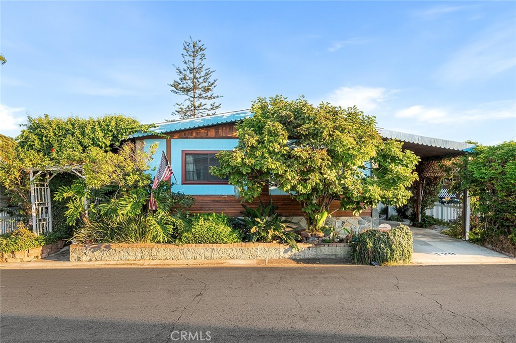 Welcome to 17701 S Avalon Blvd #129 in Carson! This 3 bedroom, 2 bathroom plus a den, home is located in a well-maintained, all-ages mobile home park with resort-style amenities. The home features a spacious floor plan. The primary suite offers a private bathroom, and two bedrooms are generously sized. Enjoy a covered carport, private outdoor space, and a storage shed. Community amenities include a pool, spa, clubhouse with bar, event venue, and a scenic walking trail around the park. Located just minutes from Cal State Dominguez Hills, LA Galaxy Stadium, and with easy access to the 110, 405, and 91 freeways. Land lease is $850/month including water and trash. A fantastic opportunity for comfortable, affordable living in the heart of Carson!