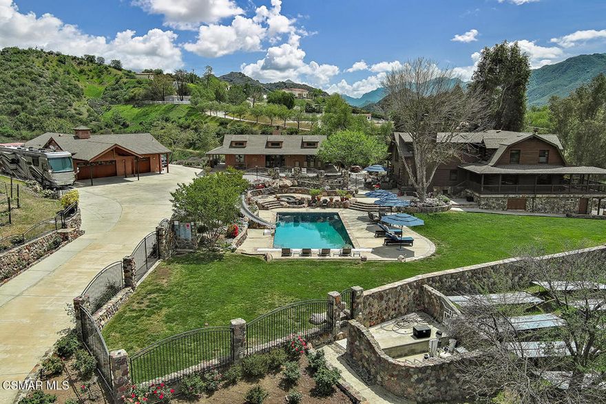 Newly priced! Private vineyard estate with International award winning wines! Welcome to 3030 Triunfo Canyon  Rd.A storybook retreat in the heart of nature.Escape to a private paradise nestled in the rolling hills of the Santa Monica Mountains in Agoura. The total living space on this spectacular property is approx. 4,600 sq.ft per owner, which includes the guest house and built out basement.This is a rare and captivating log cabin estate situated on just over 9 acres of breathtaking beauty. This property has been approved in 2020 for a large barn and has plenty of  flat land for equestrian activities and arenas.Just minutes from the iconic city of Malibu and Zuma Beach, this enchanting property offers the ultimate in peaceful living, outdoor splendor and timeless elegance. At the heart of the estate lies a warm and welcoming 3 bedroom, 2 1/2 bath log cabin with a versatile, approximately 1000 ft. non permitted built out basement, featuring an office, family room, gym area, 1/2 bath with a separate entrance and lots of storage space. Upon entering the home, you are welcomed by a cozy family room and gorgeous stone fireplace. Enjoy the well appointed kitchen where there is a spacious pantry as well as gorgeous views and a breakfast bar that flows into a spacious dining room. The living room is a perfect spot to cozy up at the end of the day. The upstairs is perfectly situated with a primary bedroom, 2 secondary bedrooms, and an extra room with no closet, yet perfect for crafting or office space.Enjoy entertaining with the perfectly situated outdoor kitchen designed for unforgettable gatherings under the stars.In addition, there is a separate approx 1,000 sq ft guest house. Enjoy cozy evenings by the fireplace and mornings spent on the porch where the lavender fields sway gently in the breeze. With its own bedroom, living room, bathroom and an inviting fireplace,  it's ideal for guests, creative pursuits or a private retreat.Wander through the property and discover two lush vineyards, producing International award-winning wines, perfect for the aspiring vintner or wine enthusiast.(Expansion of the vineyard has  been granted by L.A. County.) Relax in the grand sparkling pool and spa nestled against a backdrop of majestic mountain views. Below is a tranquil creek that winds its way through the landscape, adding a touch of serenity to every step.In addition, there is a 5 car finished garage, ideal for car enthusiasts, hobbyists, or anyone seeking extra space for a workshop, home gym or studio.Located at the top of a gated entrance and long private driveway, ensuring both privacy and grandeur from the moment you arrive, this is more than a home, it's a lifestyle. Whether you envision a private equestrian estate, a boutique vineyard retreat, or simply a secluded sanctuary surrounded by nature, 3030 Triunfo Canyon Road offers endless possibilities in an unparalleled setting.