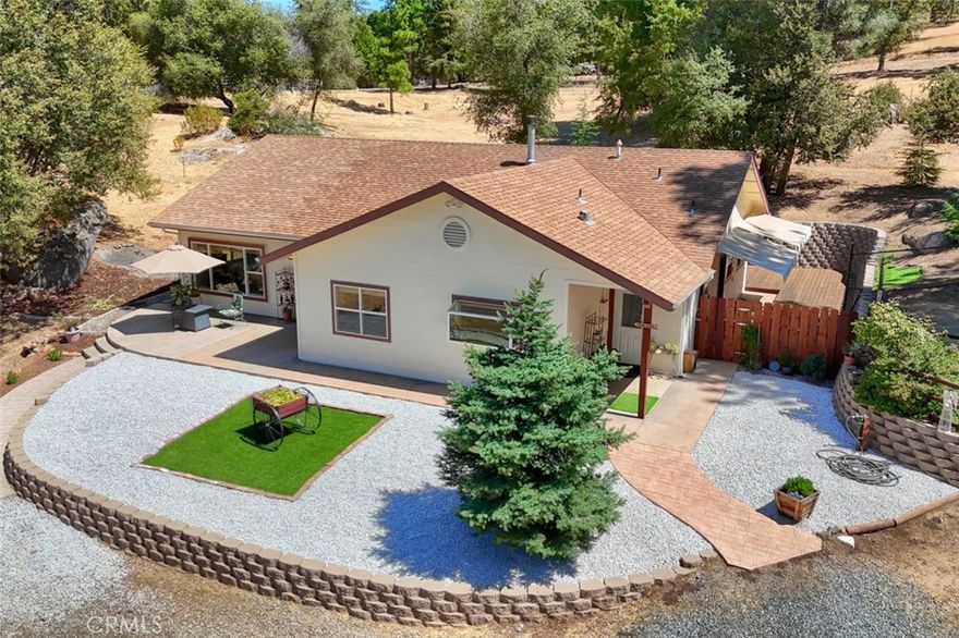Turnkey Foothill Property with Shop, Wells & Pastures! Built just 11 years ago, this 2,046 sq. ft., 3-bedroom, 2-bath home sits on 6.22 all-usable acres designed for both comfort and independence. The open floor plan connects the living room, family room, and gourmet kitchen, all filled with natural light. Highlights include a 100 GPM well plus backup well, on-demand generator, wood stove, central heat/air, and an 840 sq. ft. shop with loft and roll-up door. The property is fully fenced and cross-fenced with two pastures, a no-climb fenced backyard, three outbuildings, and fresh updates including laminate flooring, redwood decking, and new interior/exterior paint.



Enjoy the freedom of wide-open space with the convenience of paved, all-weather access. Yosemite National Park is just 45 minutes away via the scenic Merced River corridor, offering endless opportunities for outdoor adventure. Whether you’re seeking a retirement retreat, hobby farm, or property already set up for country living, this home is ready from day one.
