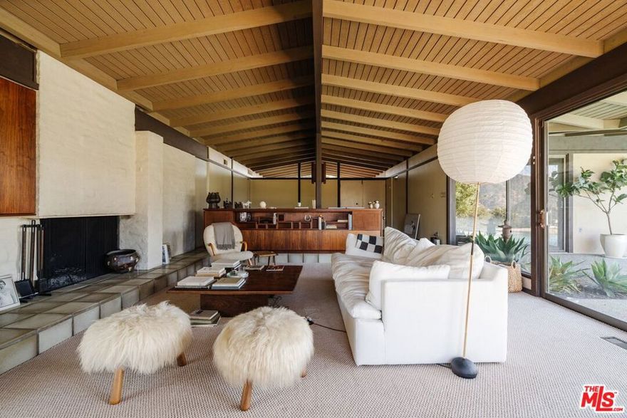 Proudly presenting The Bolton Residence, an iconic Mid-Century Modern masterpiece designed by award-winning architects Buff & Hensman. Lovingly cared for by only two owners, the home remains in exceptional condition, retaining its authentic post-and-beam construction and period details. Set on over an acre of private land with sweeping, unobstructed canyon views, the residence features 4 bedrooms and 3 bathrooms. The property includes a large pool, multiple serene outdoor spaces ideal for entertaining, an artist's studio, and an original "Moon Viewing" deck. Signature Mid-Century elements: dramatic vaulted ceilings, expansive walls of glass, original built-ins, and seamlessly integrated indoor and outdoor living.  While rich in architectural character, the home lives like new thanks to thoughtful modern upgrades enhancing functionality, including a new HVAC units, updated kitchen appliances (stove, refrigerator, dishwasher), and a dedicated laundry room with new washer and dryer. A spacious two car garage offers direct access into the home. Nestled in the prestigious enclave of Bel Air Canyon, the home offers rare privacy while remaining conveniently close to the heart of the city. This is a rare opportunity to lease a pristine Mid-Century modern residence. Flexible move-in dates available. Homes of this caliber are seldom available - schedule your private showing today.