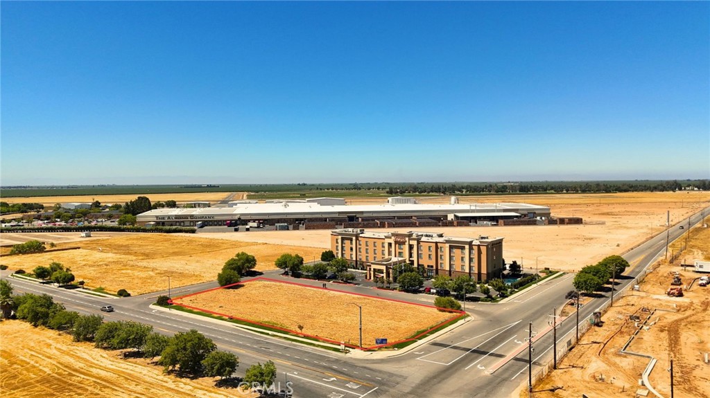 "Prime Madera Commercial Development – Fully Approved Convenience Store, Drive-Thru Restaurant & Gas Station"
Shovel-Ready Convenience Store, Fast-Food Restaurant & Gas Station – Prime Madera Location
This plan-approved development is ideally located just minutes from the new North Fork Mono Casino & Resort (Madera Casino), now under construction, making it one of the most attractive commercial opportunities in the region. The project includes a 2,992± SF convenience store with beer & wine license, a 2,000± SF fast-food restaurant with drive-thru, and a 6-pump gas station, with a total building area of 4,992± SF on a prime 1.14-acre parcel. Positioned directly off Highway 99, the site offers maximum visibility and easy access for thousands of daily commuters, long-haul truckers, and road-trip travelers.
The property sits in front of the Hampton Inn & Suites Madera, ensuring built-in demand from hotel guests and business travelers. Additional traffic drivers include Love’s Travel Stop, major almond processors, and large warehouses, creating a strong and steady customer base.
With the Madera Casino set to attract thousands of visitors annually, this project is perfectly positioned to capitalize on future growth. All entitlements and plans are fully approved and shovel-ready, giving investors and developers a head start to begin construction immediately. The combination of highway frontage, hospitality, industrial activity, and a future regional resort ensures this site will become a high-traffic hub for fuel, food, and convenience with long-term value.