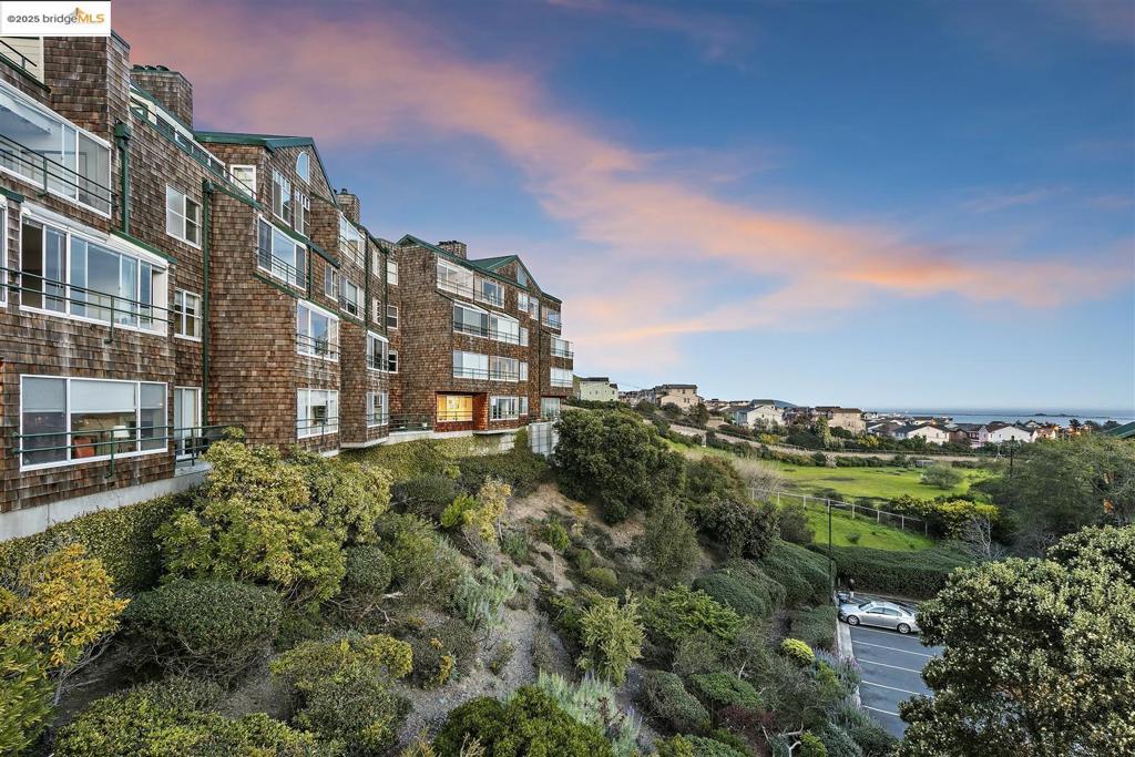 Unparalleled waterfront living and stunning, unobscured views await in this Brickyard Landing HOA condo in Point Richmond! Perfectly positioned to take advantage of panoramic views of the SF Bay, Bay Bridge, Marin, San Francisco + Oakland city views, this gracious home features 2 bedrooms, 2 bathrooms, an open LR/DR combination, an updated kitchen, a solarium/sunroom (fabulous home office or playroom!), and the opportunity to be part of a community with resort-like amenities. Features include fresh paint, ample closet and kitchen storage space, in-unit laundry, indoor parking, and a storage unit. Conveniently located elevators for residents. The HOA includes an Olympic-sized heated pool, a fitness center (with saunas), a clubhouse, tennis/pickleball courts, EV charging stations and a community garden. Located across from The Brickyard Cove Marina and close to Miller Regional Park and shoreline, the location is just minutes to the 36-mile Bay Trail and the dining and shopping in historic Point Richmond's charming town. Easy access to freeways, the Richmond/San Rafael Bridge and the SF Ferry to SF's Embarcadero. With spectacular views in every direction from inside this home and outside, this home is a hidden gem in one of the Bay Area's best kept location secrets!