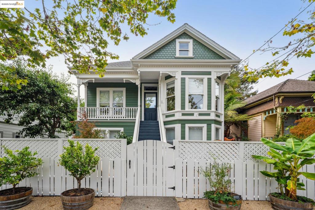 2104 Sixth Street seamlessly blends historic charm with modern style. Tucked away and off the street, with a private entrance and patio that’s equal parts retreat and city living, 2104 Sixth Street is just blocks from the restaurants, cafés and boutiques of Berkeley’s 4th Street district. With three levels inside, the entry floor features a serene and spacious primary suite with French doors to the patio, plus a second bedroom and full bath for guests, family, or a home gym. Light filters in through dramatic windows and skylights on the second level, highlighting the beautifully refinished hardwood floors and open living, dining, and kitchen space. A balcony off the dining area overlooking the private patio invites easy outdoor enjoyment. Floating above the main living area is a spacious mezzanine, adding a versatile spot for a lounge, office, or guest nook with a dedicated half bath. Distinctive architecture, private outdoor spaces, and a coveted West Berkeley location make this residence both a stunning design statement and an everyday sanctuary. Some photos may be virtually enhanced.