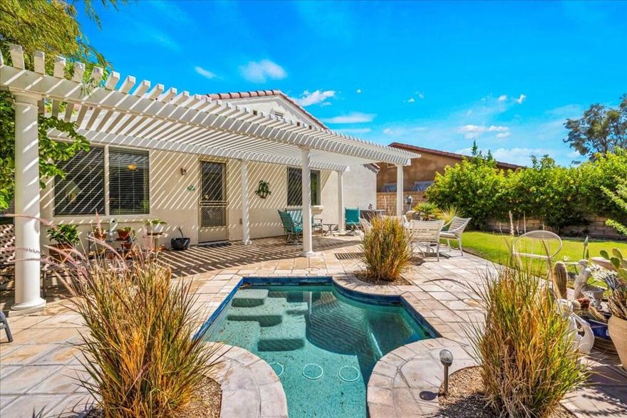 A beautiful Palm Springs home in the sought-after Four Seasons 55+ gated community. Situated on a cobblestone street originally lined with model homes, this neighborhood offers a distinctive character where no two homes are alike. The interior is light & airy with an open floor plan, perfect for everyday living. A formal dining room provides an elegant space for gatherings, and a flexible third bedroom/den offers options as an office or hobby room. The living room includes a gas fireplace, high ceilings and lots of light leading to the stunning rear grounds with built-in jacuzzi and mountain views. The kitchen is very spacious with a large center island and granite countertops throughout. The spacious primary suite features serene garden views, a large en-suite bath with step-in shower, double vanity, and large walk-in closet creating a private retreat. A private rear yard provides plenty of space for outdoor activities, gardening & more. Life at Four Seasons revolves around The Lodge, a beautiful clubhouse offering a vibrant calendar of activities, full-time staff, fitness & aerobics studios, a ballroom, game room, library, and more. Resort-style amenities include swimming pools, spas, tennis & pickleball courts, BBQ's & scenic walking trails. Low HOA's include Frontier fiber optic internet. Located just minutes from downtown Palm Springs, this home offers convenient access to fine dining, designer shopping, world-class entertainment and more.  This residence is a refined retreat capturing the essence of the Palm Springs lifestyle, where beauty, comfort & community remain in perfect balance.