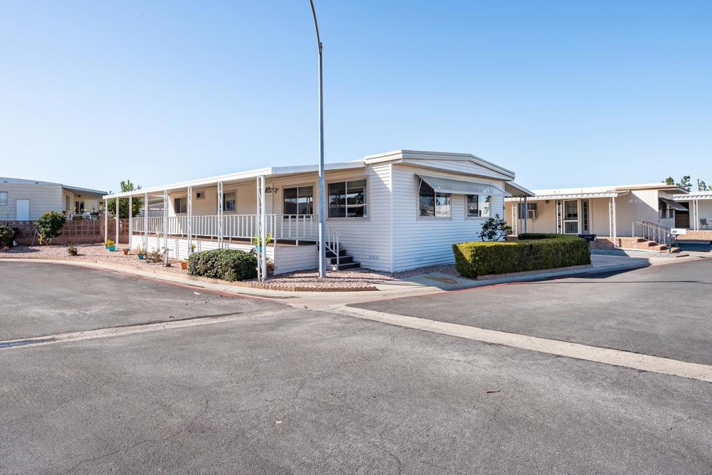 Rare beautifully remodeled 3 Bedroom, 2 Bath 1344 sq. ft. home on huge corner lot! Relax on the covered 11x43 front porch and enjoy the morning or evening watching the view of the hills! This home has all new drywall, tile floors, ceiling fans and custom countertops thrughout. Huge master with bath. Extra large hallway bathroom. Convenient kitchen /dining area with sliding doors to back deck. Easy care yard boasts Blackberry, Cherry and Pomegranate bushes to enjoy. Conveient to all freeways, shopping and entertainment. Just a few minutes to the beach. All this and low space rent and no property taxes. Buyer must be 55+ and 2nd person can be 18 and older.