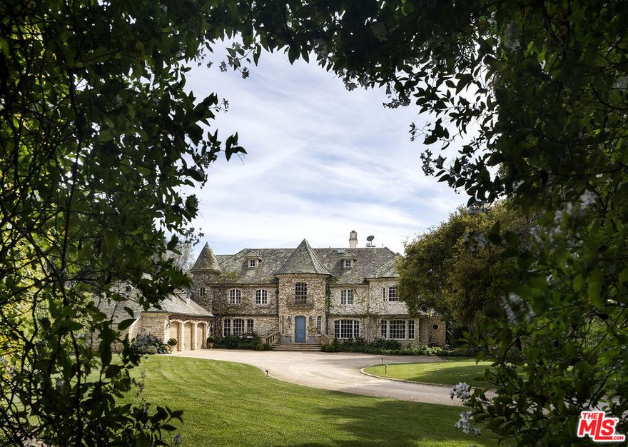 Timeless European Estate in the Heart of Montecito. Privately set behind gates on one of Montecito's most desirable lanes, 1567 E. Valley Road is a European-inspired estate that blends elegance, character, and thoughtful design. Situated on a fully usable, beautifully landscaped 1.49-acre parcel, the property offers serene privacy just moments from the charm and convenience of the Upper Village. With 8,372 square feet of total living space, the estate features six bedrooms and eight bathrooms, along with a private study, formal and informal living areas, and seamless indoor-outdoor flow designed for both relaxed daily living and sophisticated entertaining. Old World craftsmanship defines the home's architectural integrity: soaring ceilings, hand-hewn beams reclaimed from a 300-year-old European barn, Santa Rita stonework, five stone fireplaces, solid mahogany doors, and custom cabinetry all speak to timeless quality and attention to detail.At the heart of the home, a chef's kitchen features high-end appliances, a walk-in pantry, a sunny breakfast nook, and a cozy fireplace. It opens seamlessly to the great room, creating a warm and welcoming space for gathering. The nearby family room complete with a wet bar and French doors extends naturally to the outdoors, making it ideal for relaxed entertaining. The serene primary suite offers a peaceful retreat with its own fireplace, private balcony, dual walk-in closets, steam shower, and soaking tub. The third floor is a beautiful studio, newly renovated with a full kitchen and bathroom ideal for guests or creative work. Approved permits for a pool and cabana present a rare opportunity to further elevate the estate's resort-like potential. Outdoors, sweeping lawns, mature trees, fruit plantings, and curated landscaping create a tranquil, garden-like setting perfectly complementing the beauty and grace of the home itself. Elegant, timeless, and ideally located, 1567 E. Valley Road is a rare offering that captures the essence of Montecito living at its finest.