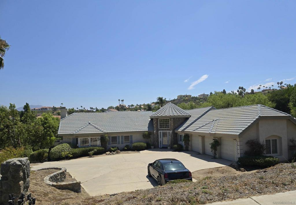 RESORT LIVING AT IT'S FINEST!! Exclusive Explorer Ridge, all custom homes and estates. Newly resurfaced Tennis court with 4 lights, basketball hoop & could be taped for Pickle Ball. Extra drainage was added before pool and tennis court were built. Many outdoor patios and built in grill make endless entertaining opportunities. LR w/FP, formal DR, FR w/FP and wet bar, informal eating area, kitchen, library, full bath, 1/2 bath, laundry room plus primary BR with fireplace, all on main floor. Dramatic turret entry with spectacular chandelier and semicircular staircase down to lower level which has 3 BRs, 3 baths plus live-in quarters with kitchenette featuring electric cook top, refrigerator & SS sink also 2nd family room, wet bar and sliding glass doors out to pool, tennis and grill area. Beautiful whitewashed Oak throughout including Kitchen cabinets. Gourmet kitchen is open to large family room with natural stone fireplace, informal eating area, wet bar and large walk-in pantry. Office/library has built-in shelving. Fireplaces in LR, FR, Primary BR & downstairs FR. New Sprinkler heads in interior fire system. 32 owned solar panels. Off street parking plus 3 car finished garage with shelving, drop down ladder to attic storage. Laundry room has 220 plus hook-ups in garage. Have fun updating this gorgeous home to your taste!!