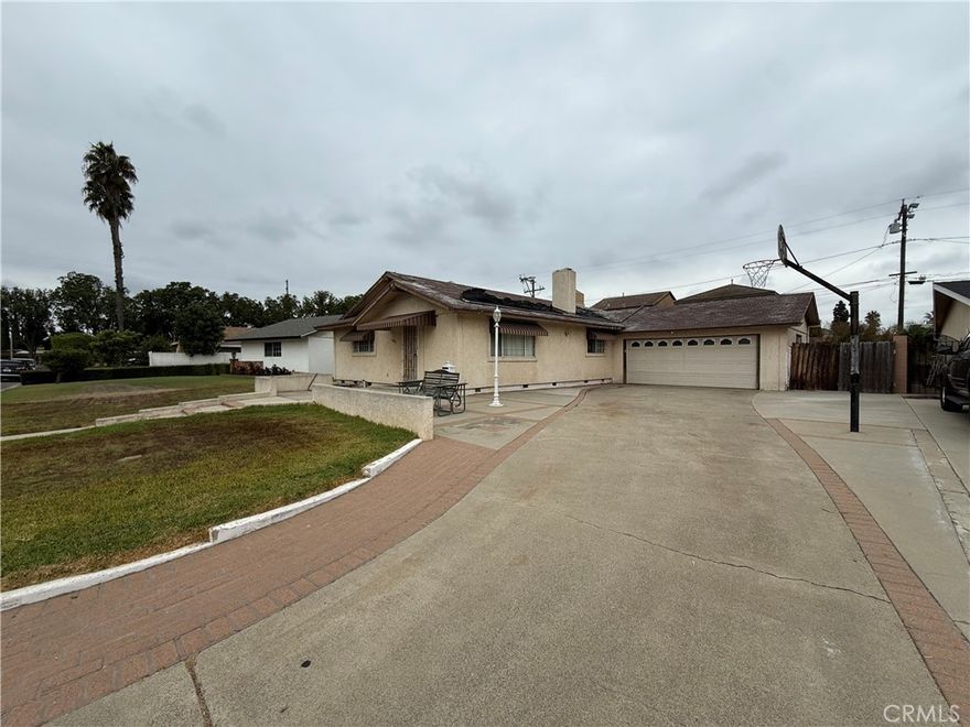 Great North Garden Grove location and wonderful opportunity for a Buyer to come in and put in some sweat equity.  Floor plan has been opened up and kitchen remodeled in the last ten years.  3 Bedrooms are all a very good size for the age of the home.  Living room has a fireplace and extends into a large formal dining area with access to the side yard.  Direct access from bedroom 3 to the 2-car garage.  Backyard has an added in-ground pool from just a few years ago that is currently drained, but appears to still be in good shape.  Previous owner passed away in the home in March of 2023.  AS-IS sale.